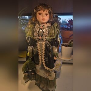 The Cathay Collection Judith Porcelain Doll in Green Dress with Stand